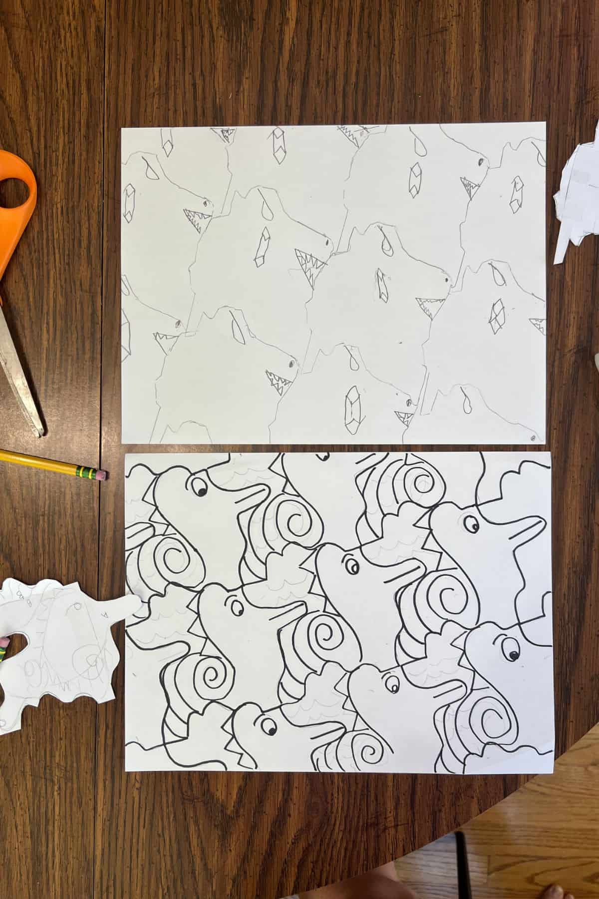 two tessellation drawings on a table.
