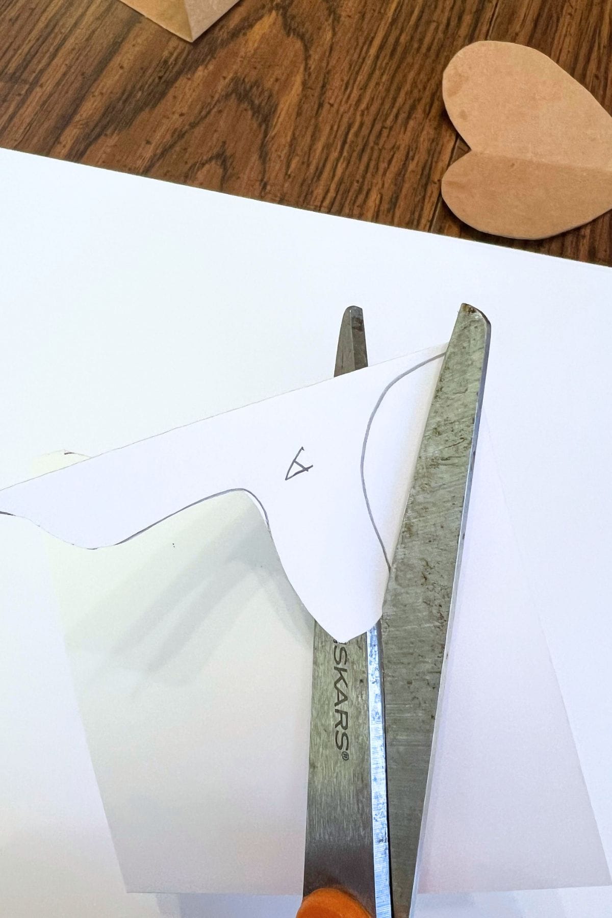 scissors cutting white paper.