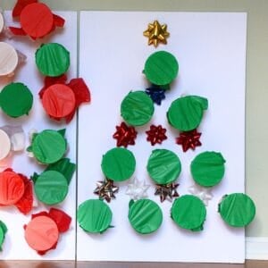 Christmas tree cup punch game board with bows on it.